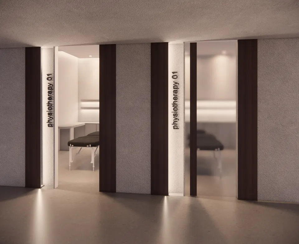 A treatment room door standing open onto a treatment table