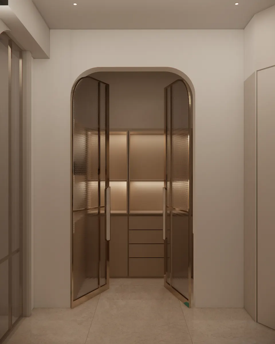 Arched bronze-framed glass doors opening to a walk-in wardrobe