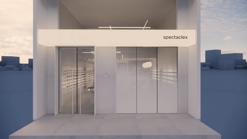 White shopfront with a glass door, a frosted window and a small sign above