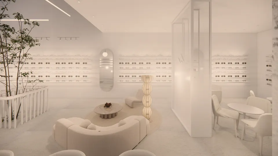 Lounge with a curved cream sofa, a stone coffee table and a tall paper lamp