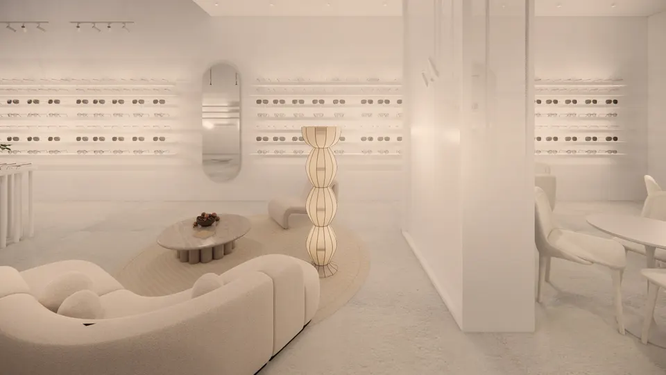 Lounge seen up close, with lit shelves of frames and an oval mirror behind