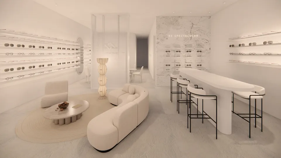 Lounge beside a long white bar table and a textured stone display wall