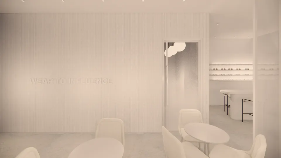 Fluted white wall with raised lettering beside the consultation tables