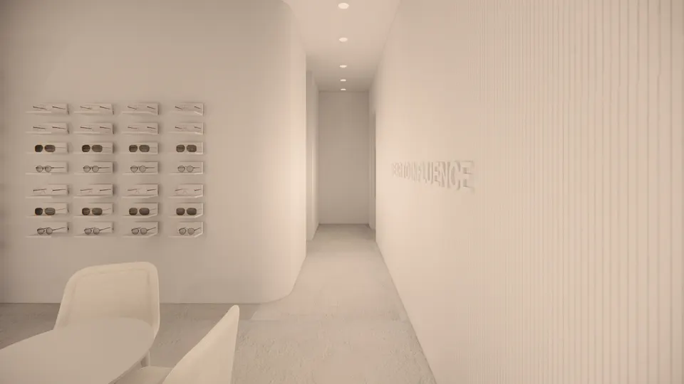 Corridor between a curved display wall and a fluted wall