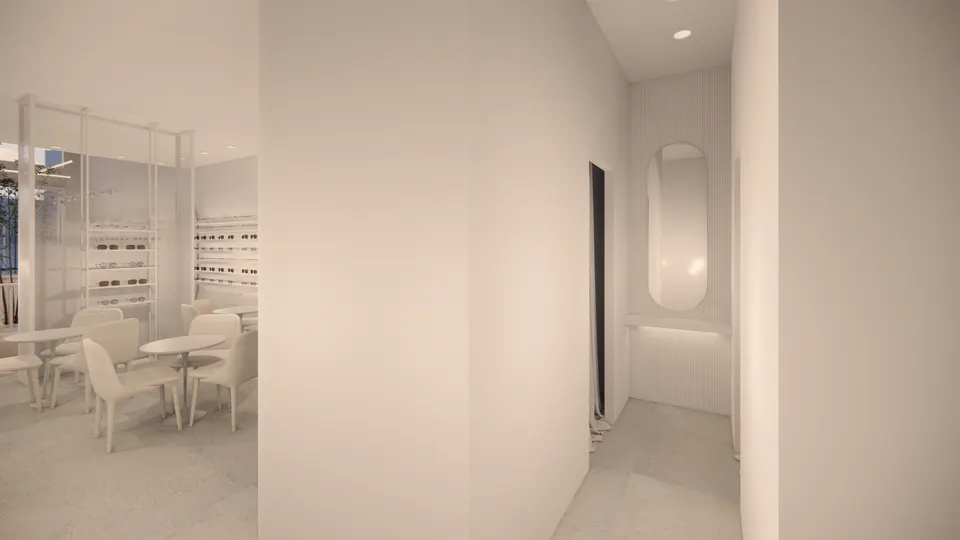 Fitting corner with an oval mirror above a lit shelf