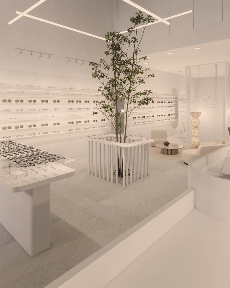 An eyewear store in white, gathered around a living tree.