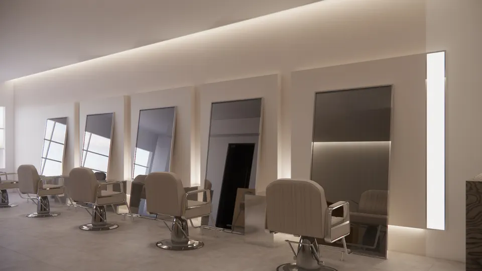 Row of styling stations with leaning mirrors along a cove-lit wall