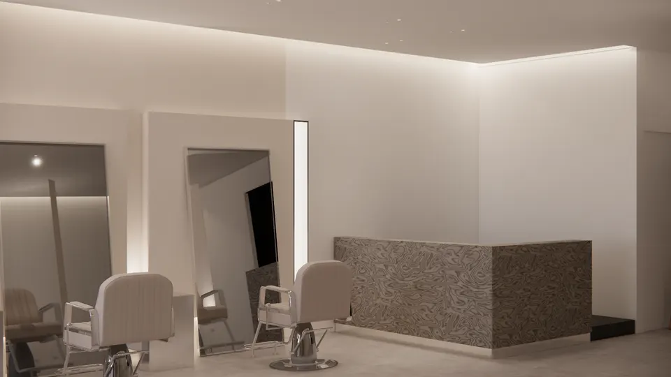 Reception counter in a swirling grey pattern beside the styling stations