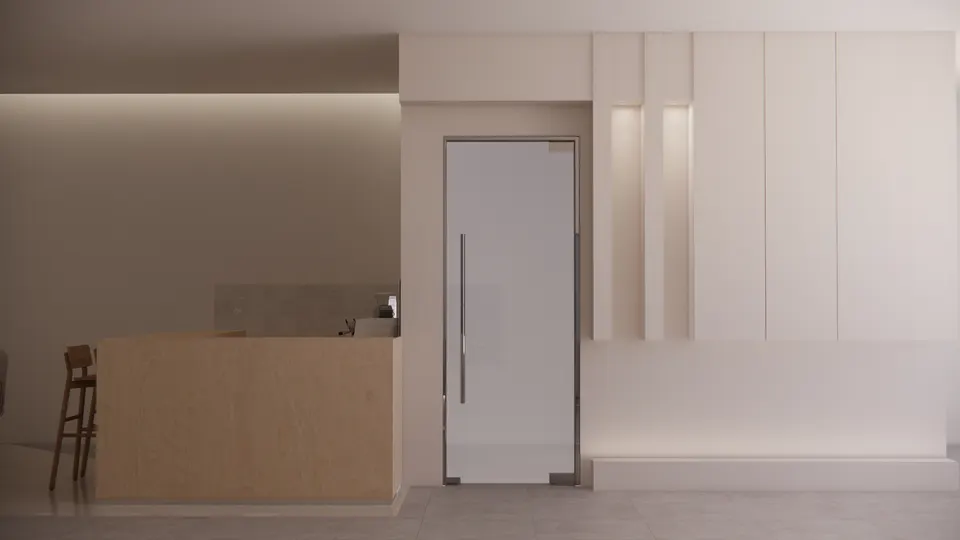 Glass entrance door beside the coffee bar and a panelled wall