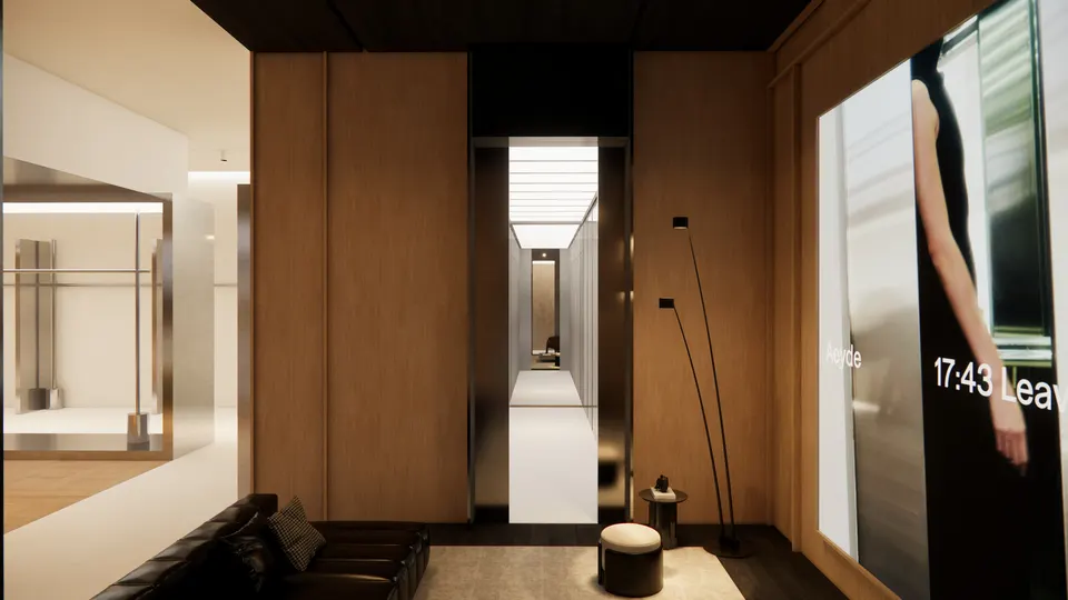 View from the lounge down a lit corridor, with the shop floor to the left