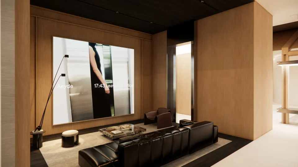 Lounge seen from the shop floor, with the screen on the far wall
