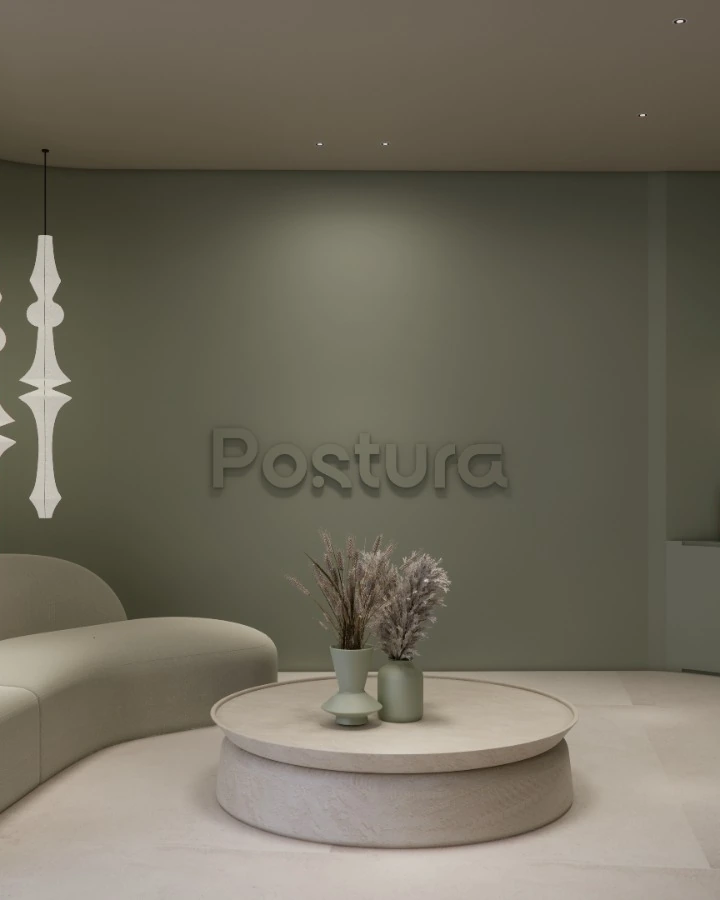 A physio and chiropractic clinic in sage, soft curves and gentle light.