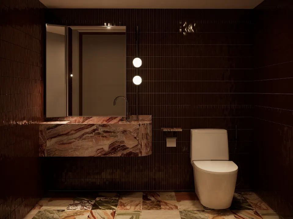 Washroom with dark tiles, a marble basin and a patterned marble floor