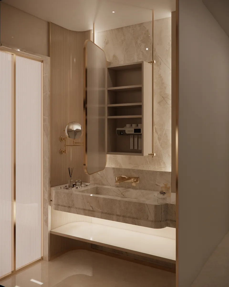 Marble vanity with fluted side panels and a brass-framed mirror