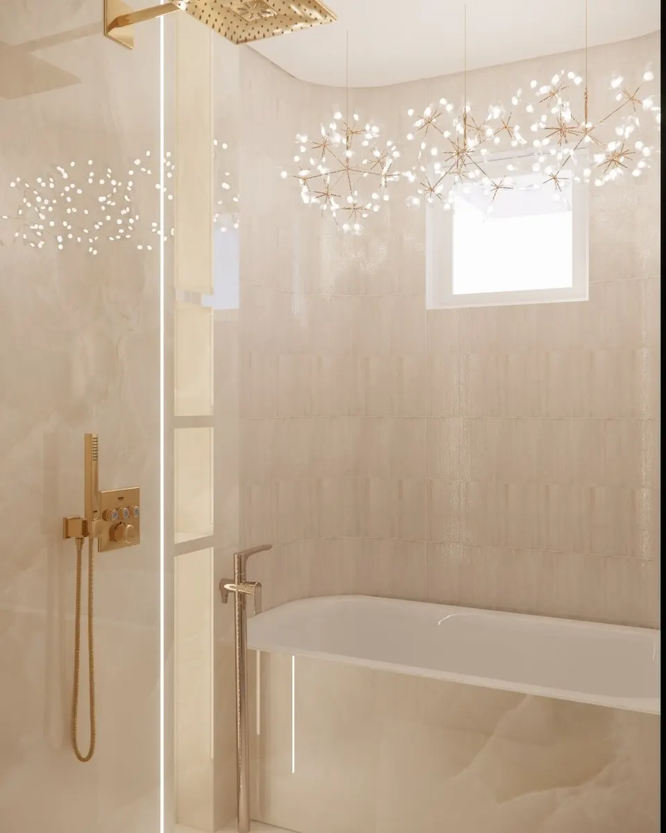Bathtub in a curved tiled alcove beneath a cluster of small pendant lights
