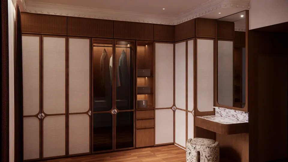 Wardrobe wall with fabric-panelled doors and a marble dressing table