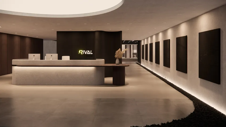 Reception desk beside a long wall of dark panels lit from above and below