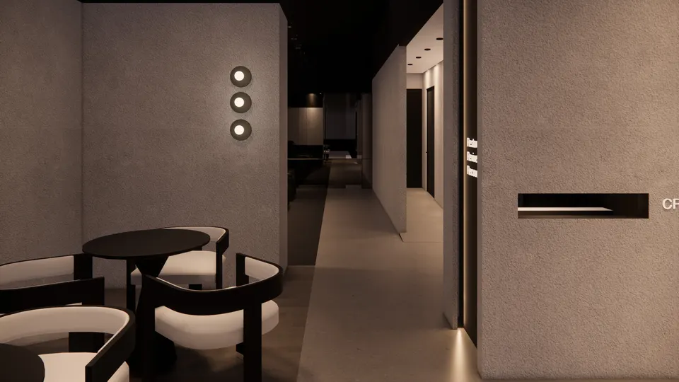 Café seating looking down a corridor between plaster walls